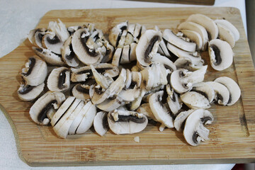 Sliced shiitake on the cutting board top view. Chinese food.