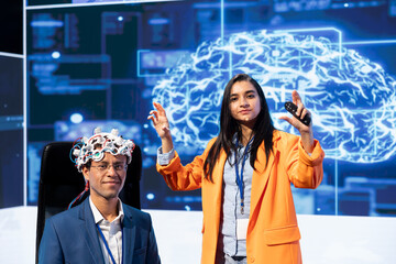 Portrait of specialist speaking at tech event, explaining impact of neural implants and AI...