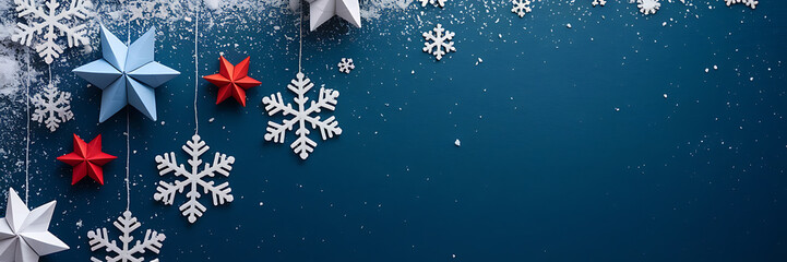 Fototapeta premium White snowflakes and red and blue stars on a dark blue background winter holiday design 