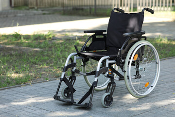 Wheelchair on paved road outdoors