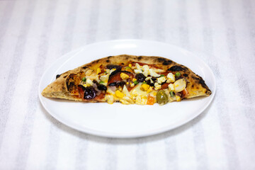 Authentic Portuguese pizza prepared with classic ingredients. Vera pizza