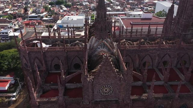 Zamora, Michoac&aacute;n, Mexico - December 24, 2023: Afternoon light shines on a historic church in the heart of downtown Zamora.