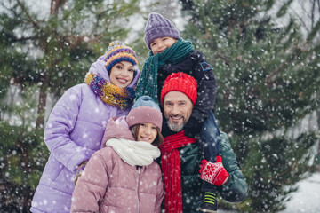 Photo of charming friendly husband wife small kid wear windbreakers embracing riding shoulders outside urban city park