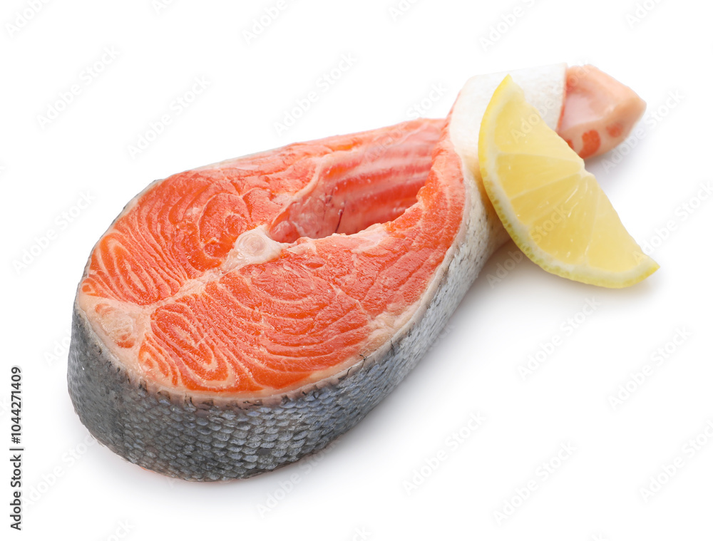 Wall mural Fresh salmon steak and piece of lemon isolated on white