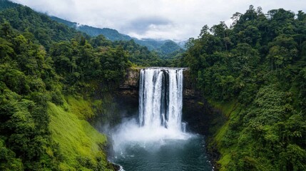 Fototapeta premium Majestic Waterfall In Dense Forest Landscape