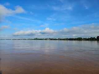 Calm River with Bridge and Blue Sky