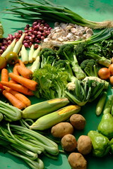 Sayur Mayur Sayuran Segar is fresh vegetables from the tropics. there are carrots, mustard greens, onions, garlic, long beans, broccoli, sweet corn, cucumbers, squash, lettuce, potatoes, leeks, celery