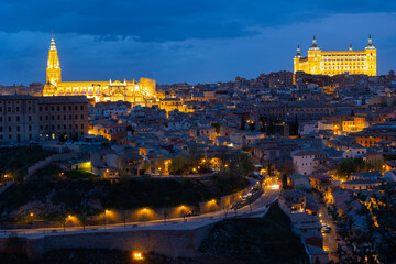 Obraz premium Aerial view of the evening city of Toledo, which is the capital of the autonomous community of Castile-La Mancha and included ..in the UNESCO World Heritage List, Spain