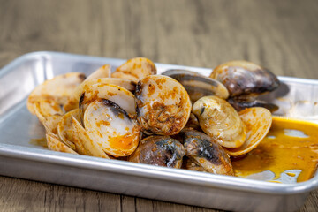 Buttery order of clams served in a pile on a tray