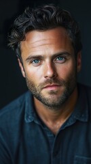 Obraz premium Portrait of a Handsome Man with Blue Eyes and a Beard