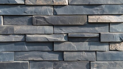 Closeup view of a textured stone wall highlighting the intricate patterns and details of the stonework