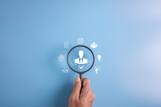 HR hiring recruit job.searching job and business leadership concept.hand holding magnifier with person icon.