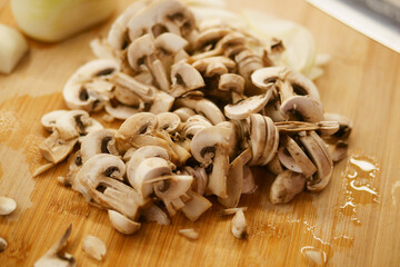 Chopped Fresh Mushrooms Placed on a Rustic Wooden Cutting Board for Various Culinary Creations