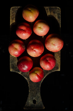 plum on cut board