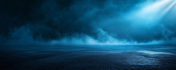 Naklejka premium Blue fog with a bright light over a dark blue and textured surface.