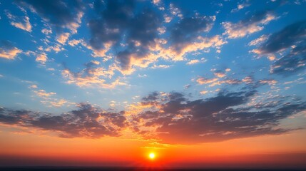 Fototapeta premium A vibrant sunset with colorful clouds illuminating the sky.