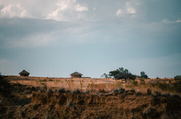 straw huts on meadow