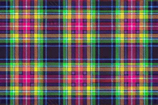 Seamless tartan plaid pattern with a modern twist featuring bold neon colors