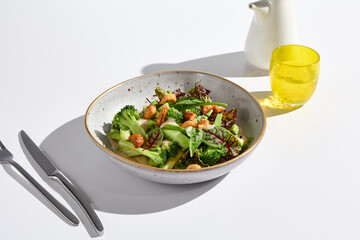 Fresh Green Salad with Cashews and Avocado in Minimalist Bright Setting