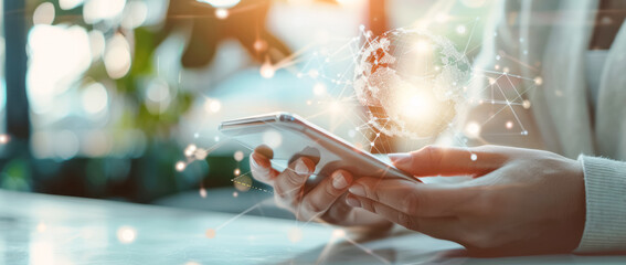 Digital communication: hands holding smartphone with virtual globe hologram. Copy space, banner