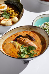 Vibrant Tom Yum Soup with Seafood in High-Contrast Lighting