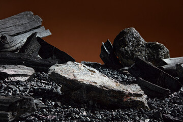 A rock platform with a rough, spiked surface is a space to display products, placed on a gravel...