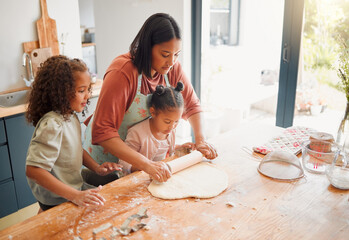 Happy, baking and kids with mom in kitchen with dough, cooking and youth learning in home. Girls, rolling pin and breakfast with care, support and fun with culinary development and love together