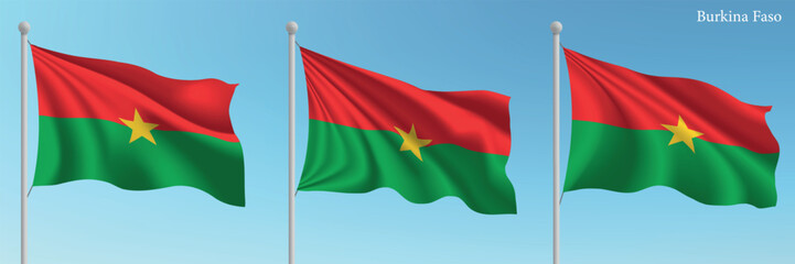 Set of three flags of Burkina Faso waving on flagpoles