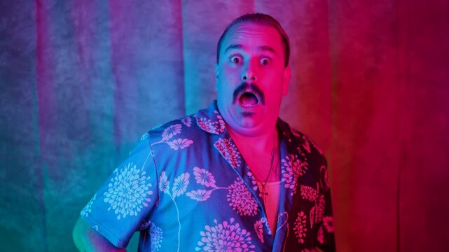 A surprised man wearing a bright, colorful shirt stands out brilliantly against an equally vibrant background, exuding a sense of strong emotions and surprise that truly captivates all viewers