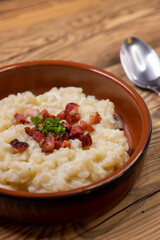 Slovakian halusky served with sheep cheese and roasted bacon