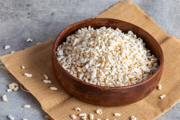 Khoi is a puffed rice snack, light and crispy, commonly enjoyed in Bengal, used in traditional dishes and rituals.