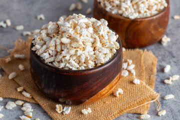 Khoi is a puffed rice snack, light and crispy, commonly enjoyed in Bengal, used in traditional dishes and rituals.