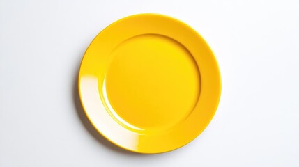 Bright yellow plate set against a clean white background ideal for culinary or kitchen themed designs