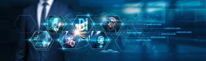 BI. Businessman using tablet analyzing business intelligence (BI) reports, data visualization, key...