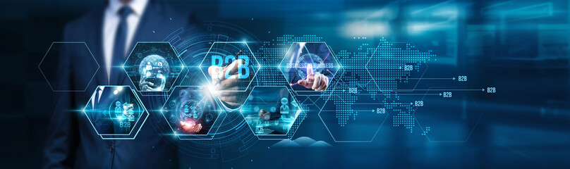 Business to business. Businessman using tablet analyzing B2B sales performance, transactions, customer relations, supply chain efficiency, marketing strategies, and partnership opportunities.