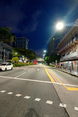 Asphalt Road and City Street With Modern Building at Night