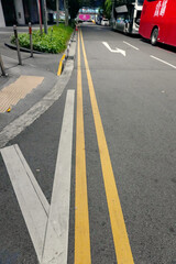 Obraz premium Elevated view of traffic signs painted on an avenue 