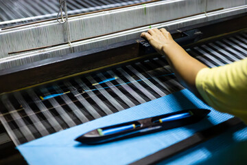 Shuttle.  The last working silk loom in Baan Khrua district, Bangkok.  The flying shuttle can be...