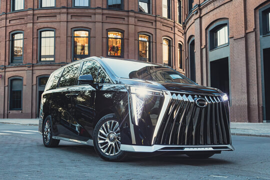 Russia, Moscow - September 5, 2024: Black chinese minivan GAC M8 , VAN  trumpchi m8 parked on the street. Front view, side view