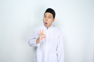 funny muslim man asian give okay signs with shocked expression isolated on white background