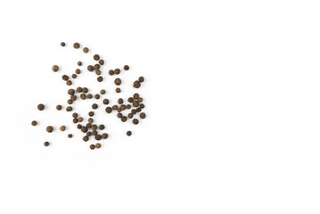 black peppercorns on white background with copy space
