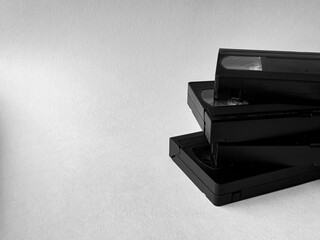 Stack of vintage vhs tapes on minimalist white background