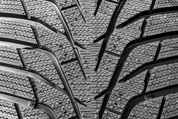 Modern winter tire tread closeup that has passed the braking test on ice