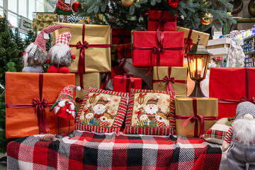 Сhristmas decorations and gifts in red wrapping under the Сhristmas tree