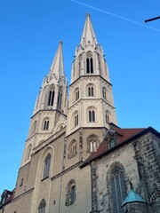 Fototapeta premium Pfarrkirche St. Peter und Paul in Görlitz is a majestic church, renowned for its Gothic architecture and towering spires, standing as a historic city landmark.