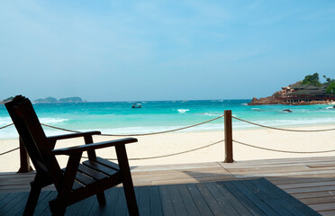 Wooden chair standing on a terrace facing the sea in redang island