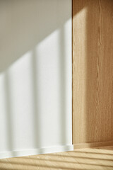 A living room scene with warm sunlight, natural
contrast of objects, and relaxed wood tones.