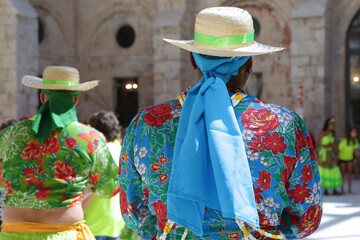 Dancers dancing and wearing one of the traditional folk costume from Brazil