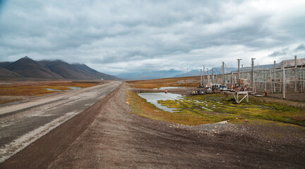 Exploring the remote industrial landscape of Longyearbyen in Svalbard on a cloudy day
