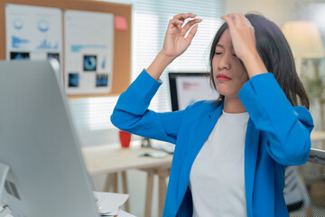 Stressed businesswoman in modern office, tired and frustrated, feeling burnout and anxiety. Shows...